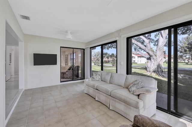 unfurnished living room featuring ceiling fan