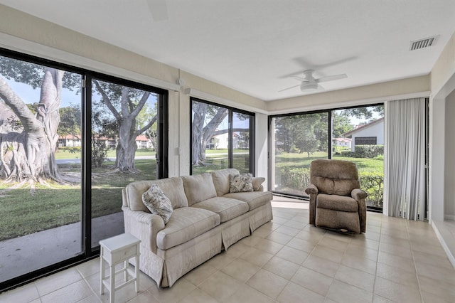 sunroom / solarium featuring ceiling fan