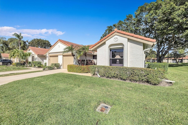 mediterranean / spanish-style house featuring a garage and a front lawn