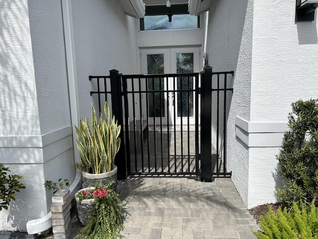 view of gate featuring french doors