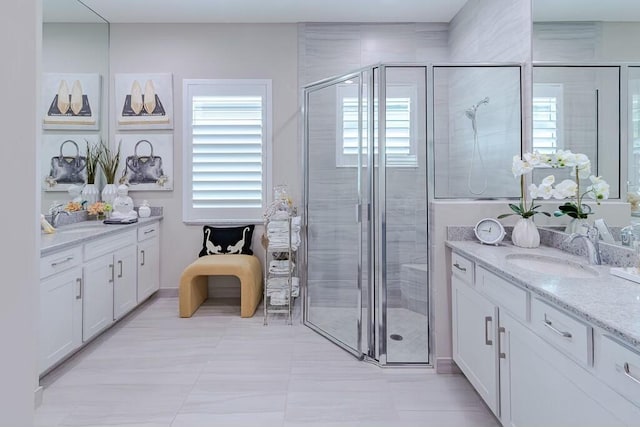 full bath featuring a stall shower and vanity