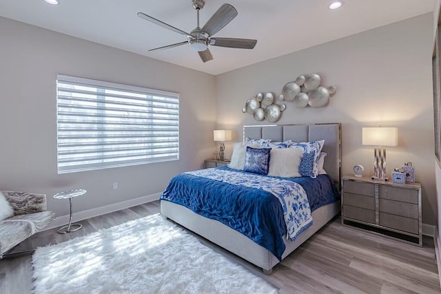 bedroom featuring recessed lighting, a ceiling fan, baseboards, and wood finished floors