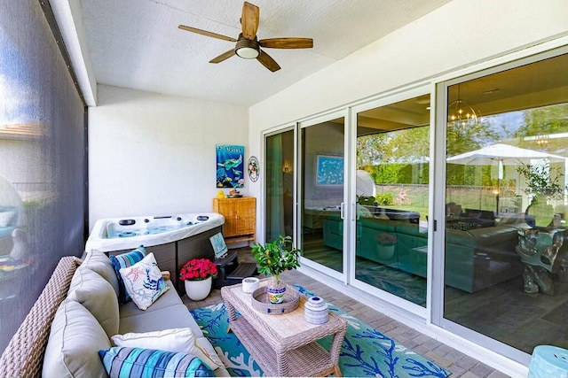 sunroom with ceiling fan