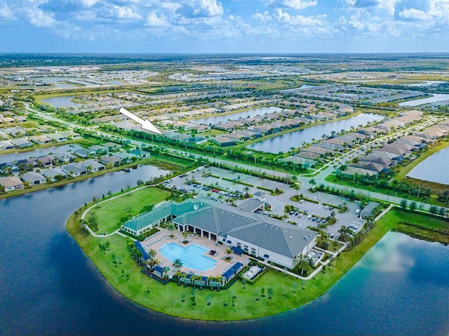 birds eye view of property with a water view