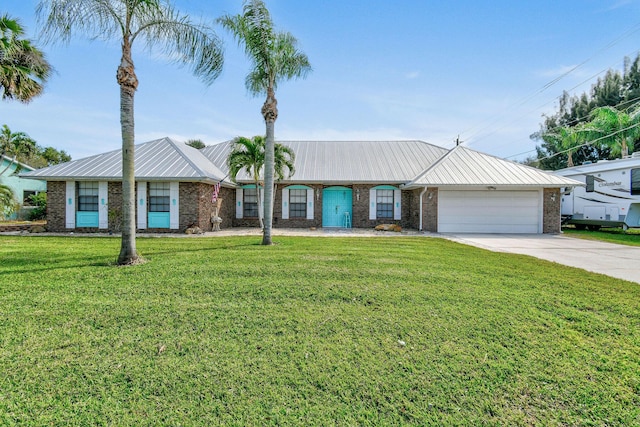 ranch-style home with a garage and a front yard