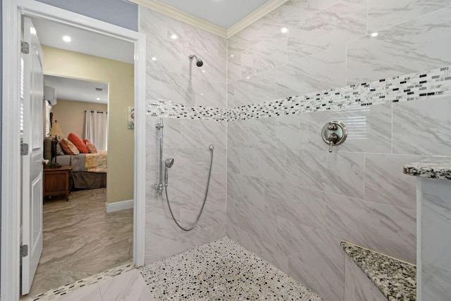 bathroom with crown molding and tiled shower