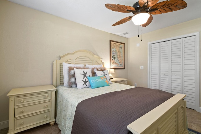 bedroom with ceiling fan and a closet