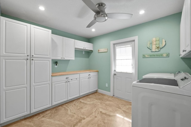 laundry room featuring ceiling fan, cabinets, and washing machine and dryer