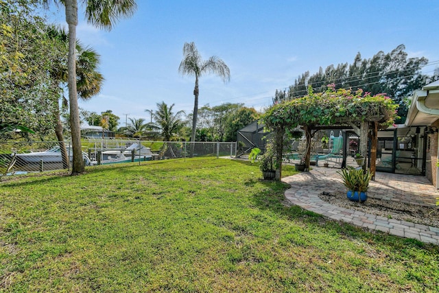 view of yard featuring a fenced in pool and a lanai