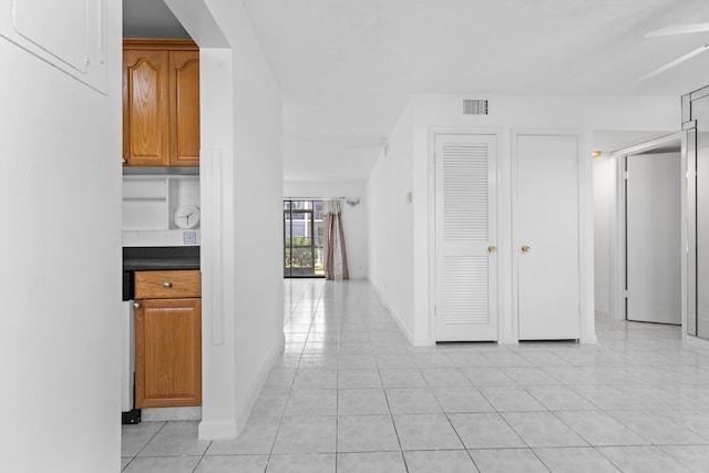 hallway with light tile patterned flooring