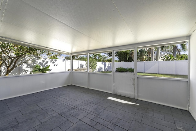 unfurnished sunroom featuring a healthy amount of sunlight