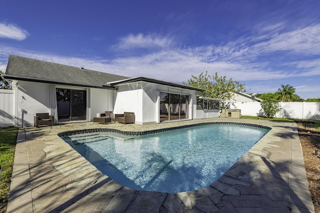 view of pool with a patio and outdoor lounge area