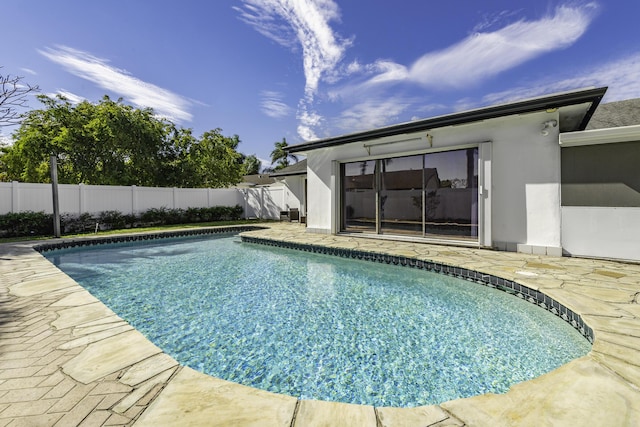 view of swimming pool featuring a patio area