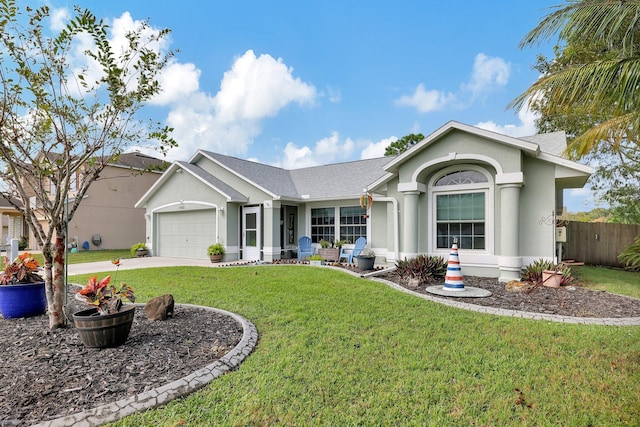 ranch-style house featuring a garage and a front yard