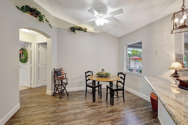 dining area featuring ceiling fan and dark hardwood / wood-style floors