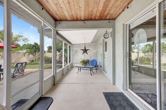 sunroom with wooden ceiling