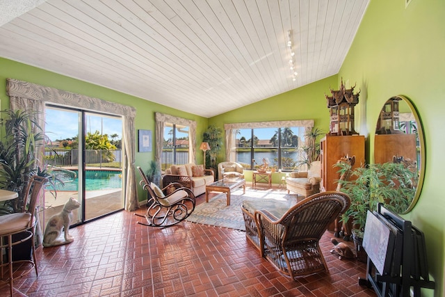 sunroom / solarium featuring lofted ceiling and wood ceiling