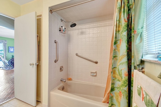 full bath with shower / bath combo and tile patterned floors