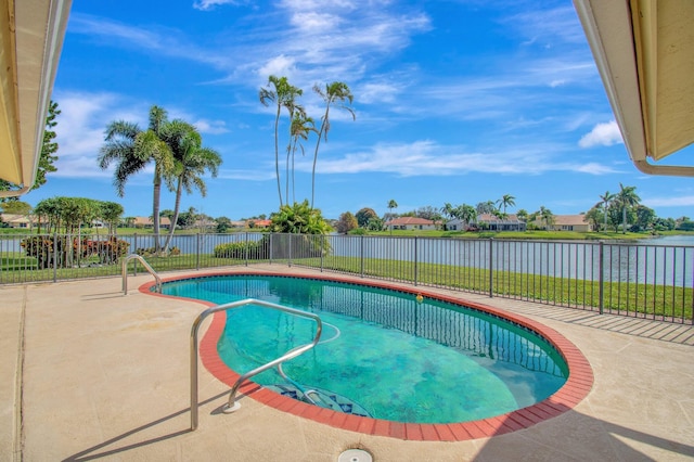 view of swimming pool with a patio area, a water view, a fenced backyard, and a fenced in pool