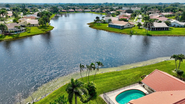 birds eye view of property featuring a water view and a residential view