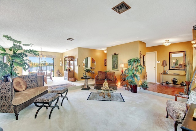 carpeted living room featuring a textured ceiling