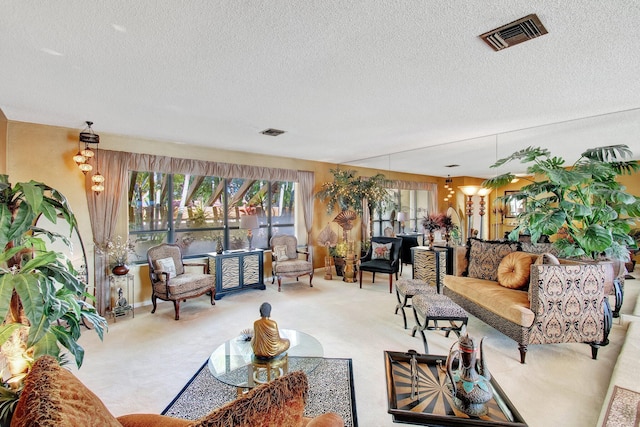 living room with light colored carpet and a textured ceiling