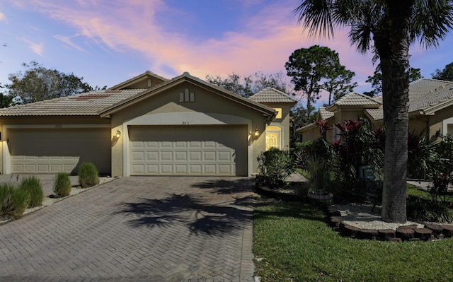 view of front of property with a garage