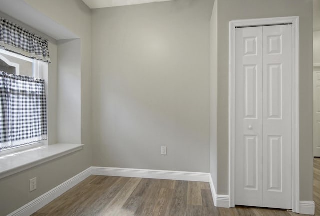 spare room with light hardwood / wood-style flooring and a healthy amount of sunlight