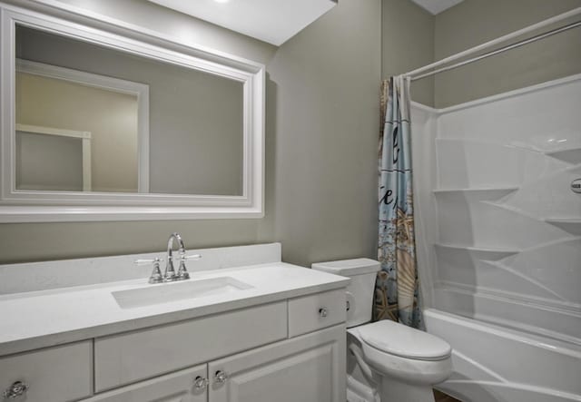 full bathroom featuring vanity, toilet, and shower / bath combo with shower curtain