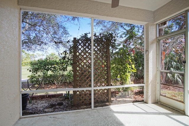 unfurnished sunroom with plenty of natural light