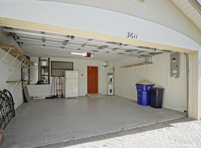 garage with white refrigerator, a garage door opener, electric panel, and electric water heater