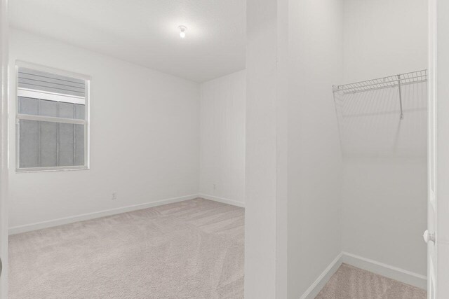 full bathroom featuring vanity, hardwood / wood-style floors, tiled shower / bath combo, and toilet