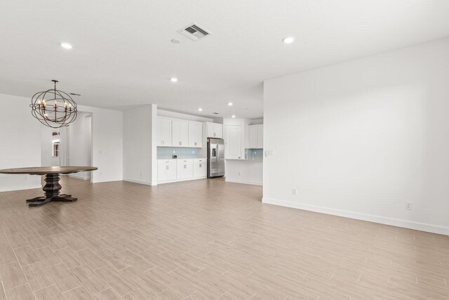 unfurnished living room featuring light hardwood / wood-style flooring