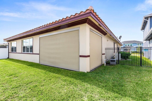 view of side of home featuring a lawn