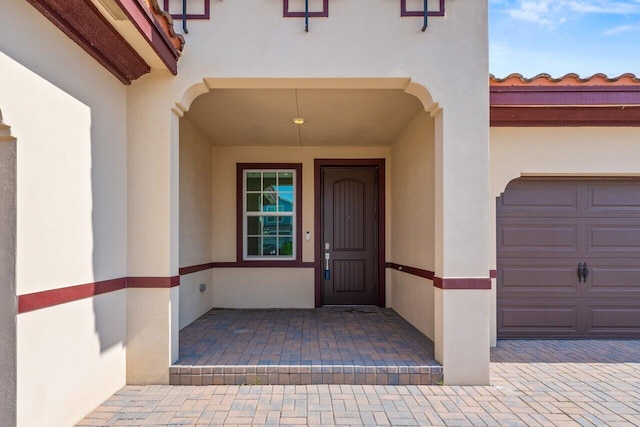 property entrance featuring a garage