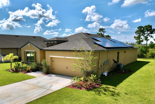 view of front of home featuring central AC unit, a garage, a front lawn, and solar panels