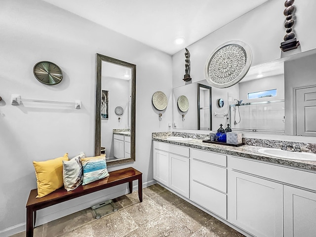 bathroom featuring a shower and vanity