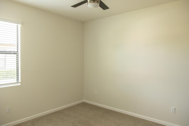 tiled living room with ceiling fan and a textured ceiling