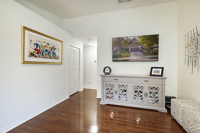 hallway featuring dark wood-type flooring