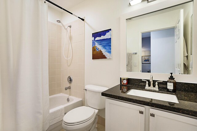 full bathroom with vanity, toilet, and shower / bathtub combination with curtain