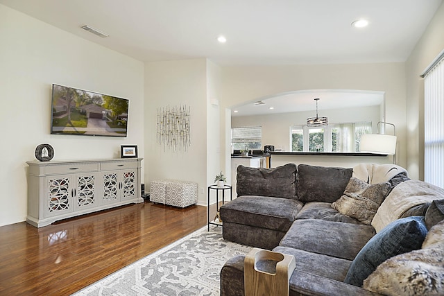 living room with dark hardwood / wood-style flooring