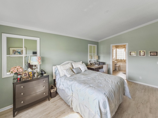 bedroom featuring vaulted ceiling, ensuite bath, ornamental molding, and light hardwood / wood-style floors