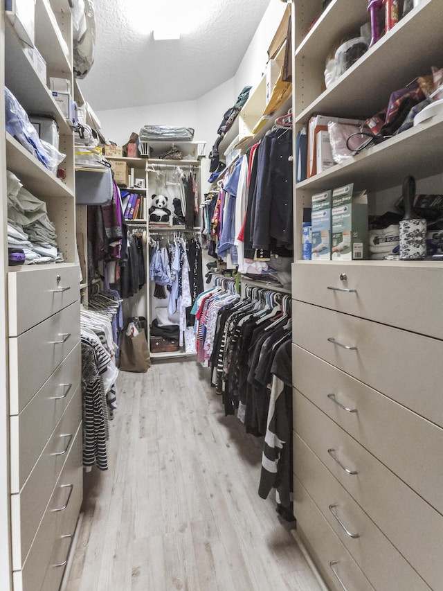 walk in closet featuring light wood-type flooring