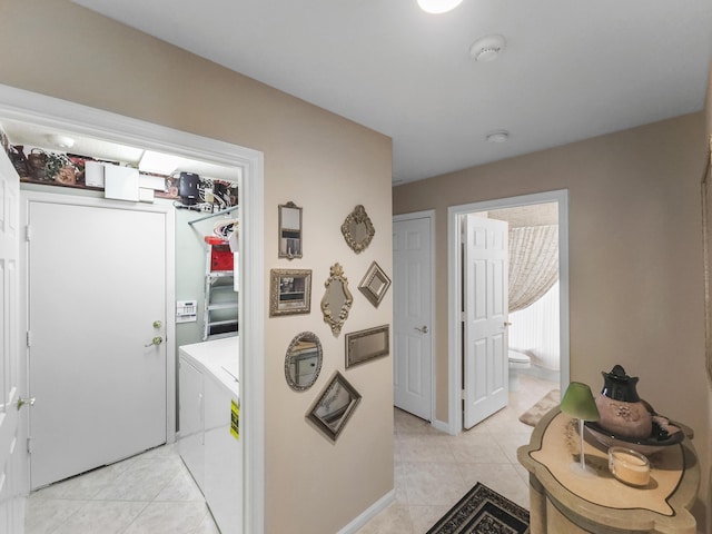 laundry room with light tile patterned flooring