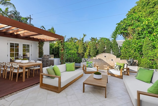 view of patio / terrace featuring a deck, outdoor lounge area, a grill, a pergola, and french doors