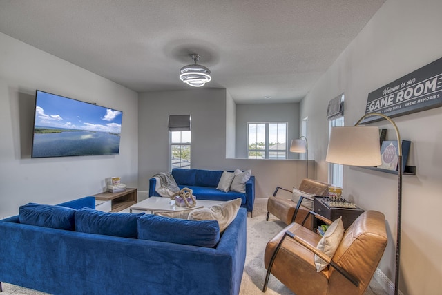 living room with light carpet and a textured ceiling