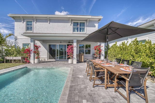 back of house with a patio