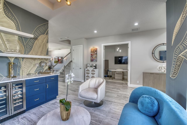 living room featuring indoor bar and beverage cooler