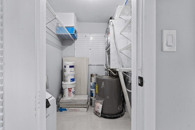 utility room with water heater