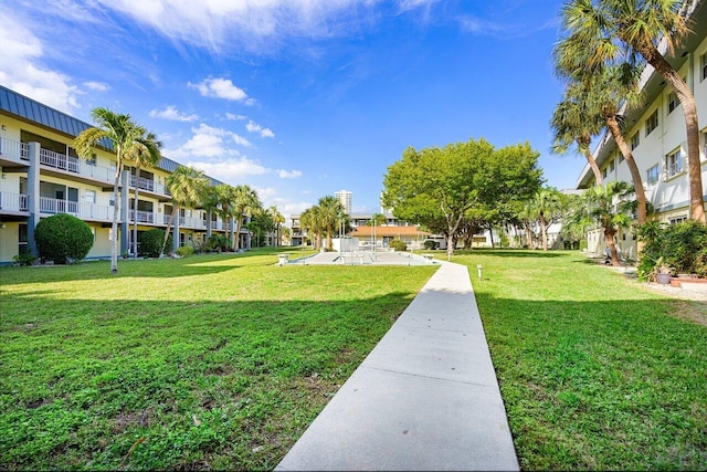 view of home's community with a lawn